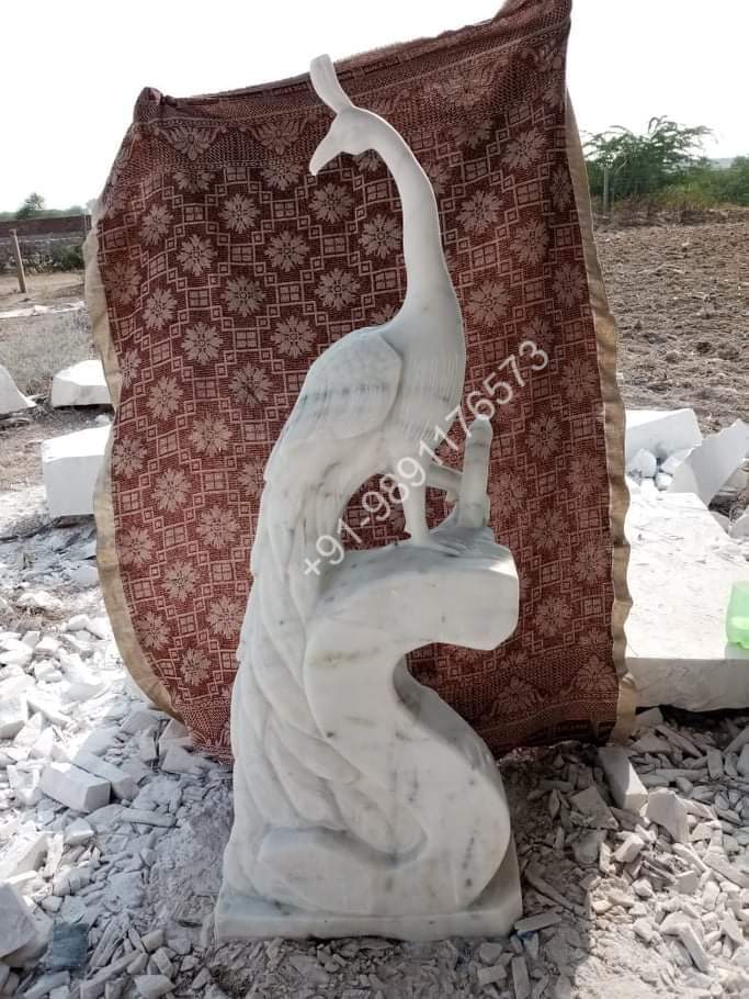 MARBLE STATUE IN PEACOCK